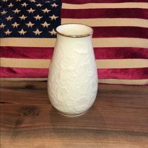 Lenox Vase trimmed in gold and has flowers